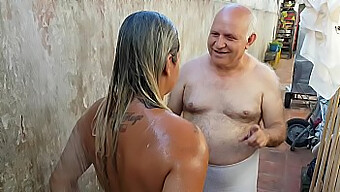 Old Man Helps Young Beach Acquaintance With A Bath