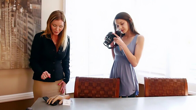 A mature woman engages in sexual activity with a younger girl, featuring lesbian sex between an older and younger woman