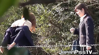 Japanese Schoolgirls Indulge In Kinky Peeing Outdoors While Holding Each Other